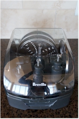 The Breville comes with an array of blade/disc attachments.