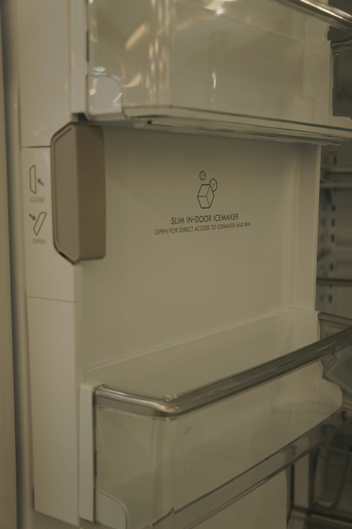 The automatic icemaker is built into the refrigerator door to save space in the freezer.