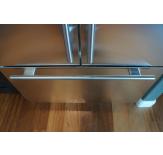 The freezer door also features matching tubular handles.